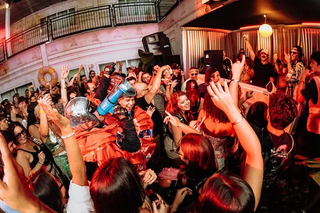 Friends dancing indoors at III Points 2025