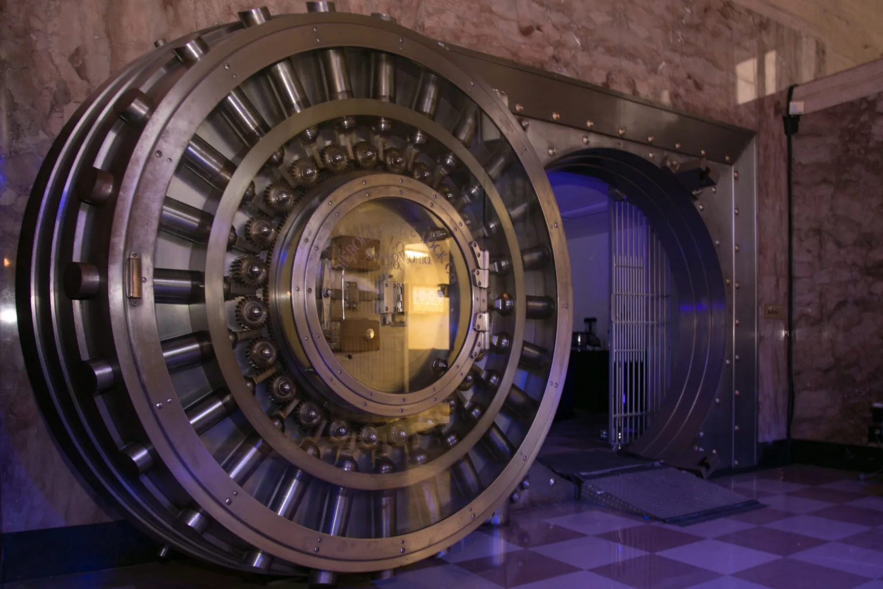 The vault door lit purple at night